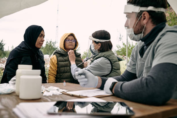 istock Holding Medical Consultation For Migrants 1340758382