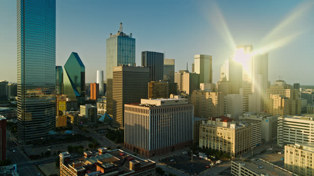 Aerial View of Downtown Dallas at Sunset with Dramatic Lens Flare