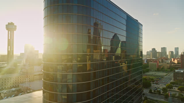 Aerial View of Downtown Dallas Reflected in Windows with Reveal of Reunion Tower