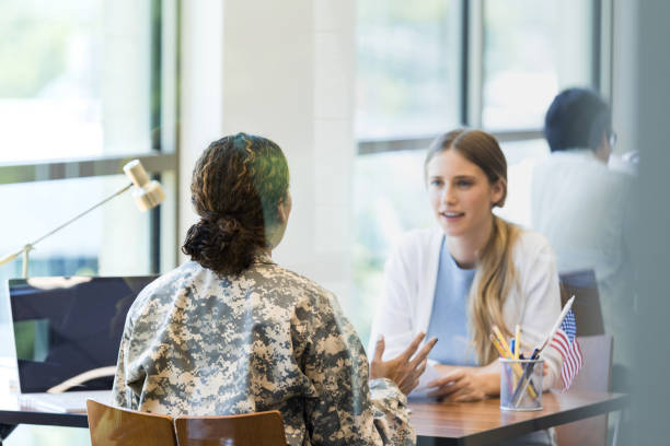 istock Unrecognizable soldier describes application process to young woman 1340760431