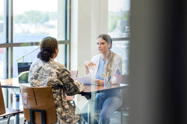 istock Unrecognizable female soldier talks with potential recruit 1340760439