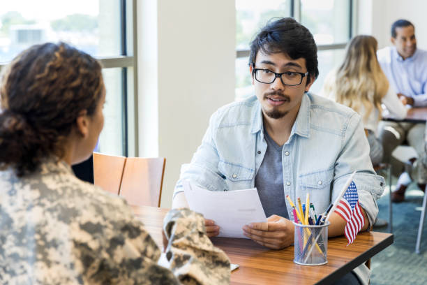 istock Mid adult man asks unrecognizable soldier question 1340760448