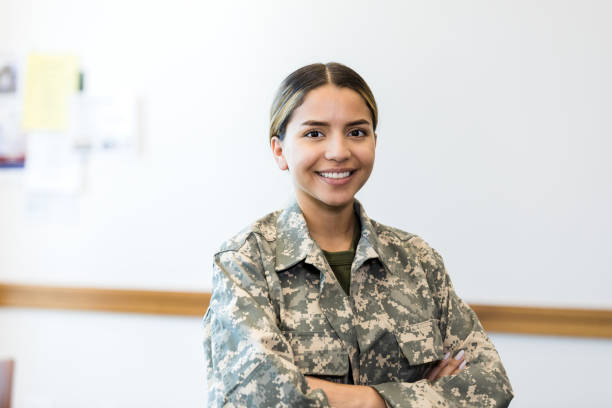 istock Beautiful female soldier standing in office 1340760467