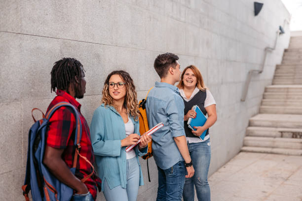 istock Students discussing about class in lobby of university 1340760704