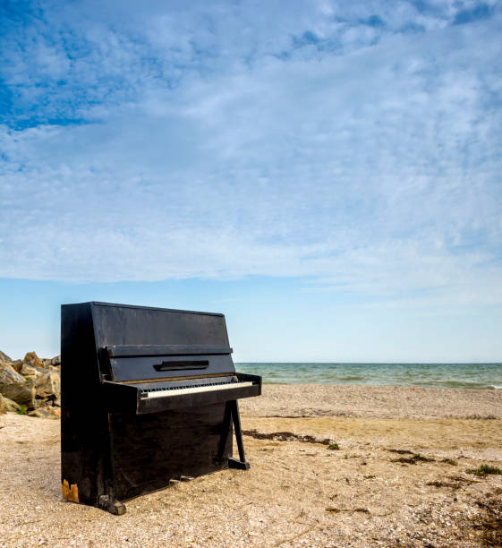istock old piano on the sea beach 1340761710