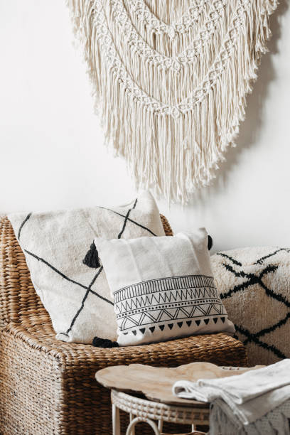 istock Living room with wicker armchair, macrame and coffee table 1340764670