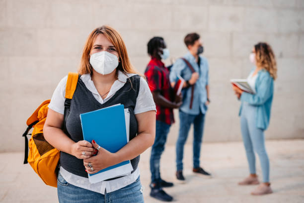 istock College student with mask in hallway 1340764727