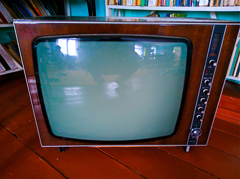 Stack of retro vintage televisions stacked. Lifestyle details, old TV set