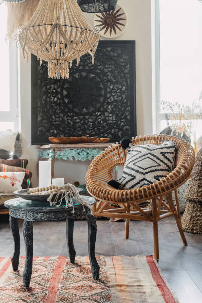 istock Comfortable living room with rattan armchair in boho interior 1340766225