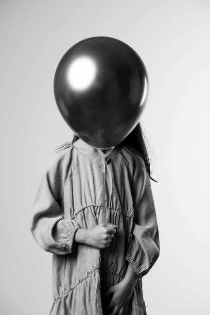 istock Girl Holding Balloon 1340770899