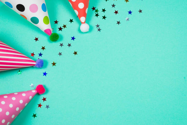 istock Colorful birthday caps on a blue background. Top view. 1340774066