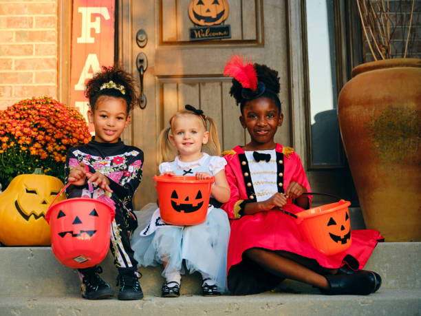 istock Children in Costume on Halloween Trick or Treating 1340774492