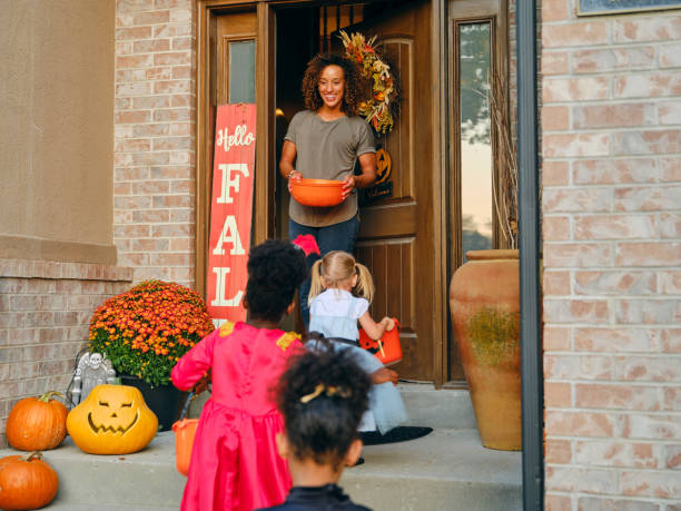 istock Children in Costume on Halloween Trick or Treating 1340774534