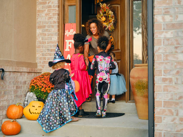 istock Children in Costume on Halloween Trick or Treating 1340774538