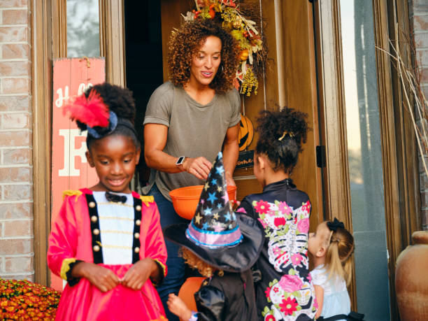 istock Children in Costume on Halloween Trick or Treating 1340774545