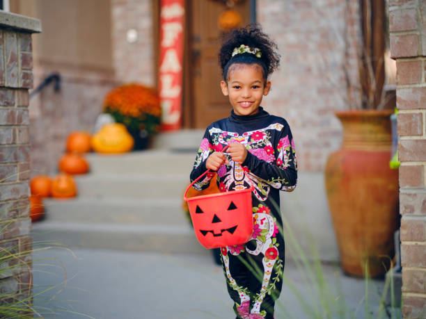 istock Children in Halloween Costume 1340775599