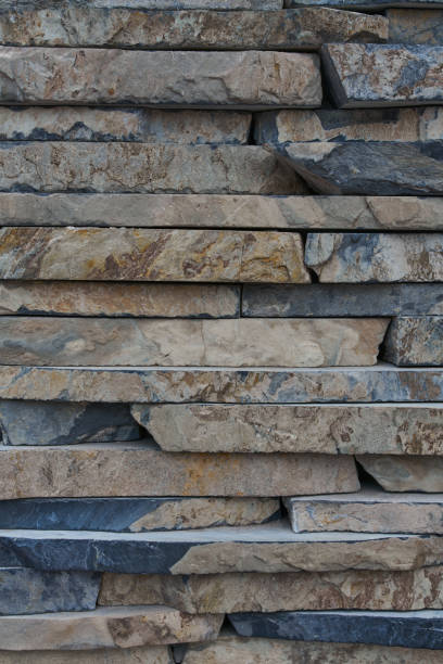 istock Inlaid cut stone wall inlaid and arranged forming a decorative residential pattern 1340775677