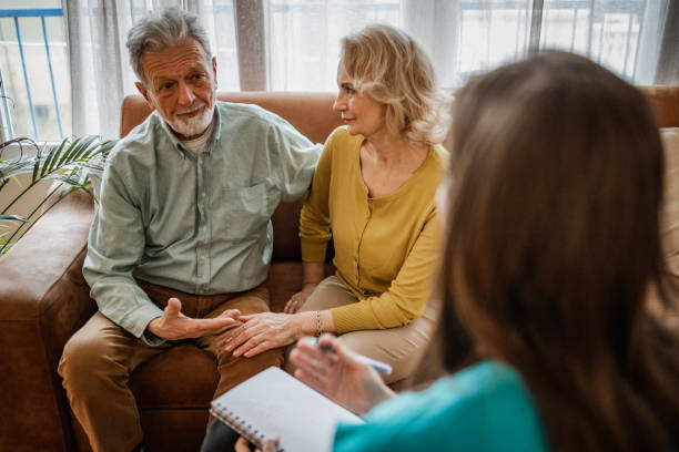 istock Senior couple solving their marriage problems with psychotherapist 1340775978