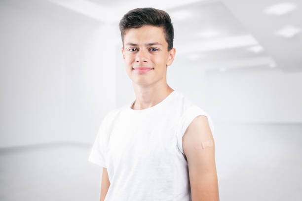 Teenager after vaccination - Covid 19 vaccination stock photo