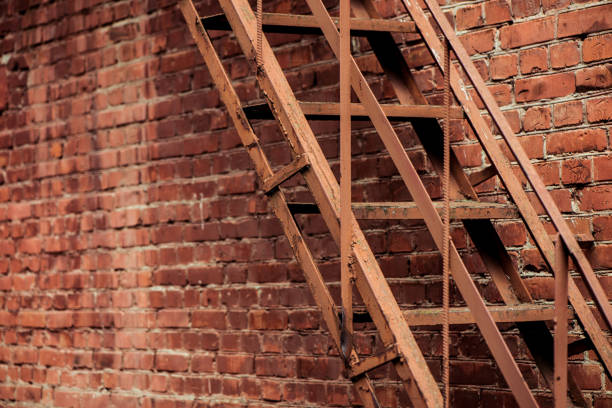 damaged brick vintage building facade with old elements