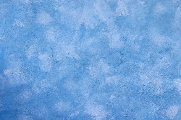 istock Natural old wall with fresh plaster, painted blue, texture for photo design, for making photo backdrops, banner for advertisement or invitation, place for text, 1340778021