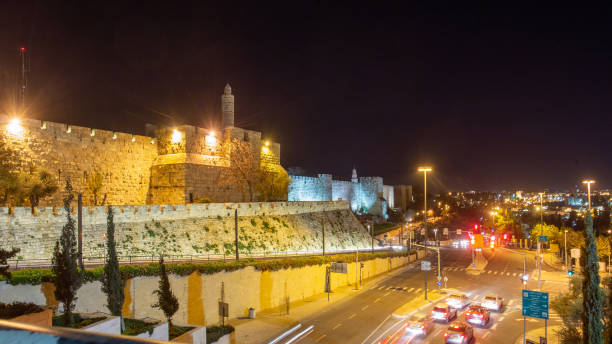 istock View from Garbage gate  (Dung gate) of Old Jerusalem. Night view .  Car moving on road 1340778165