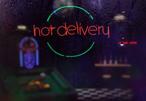 istock Neon Hot Delivery Sign in Rainy Window 1340778338