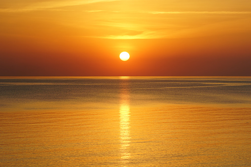 beautiful sunset in the baltic sea, sun above the horizon