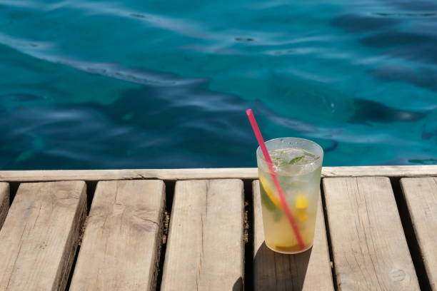 istock cold drink standing on wooden floor 1340785129