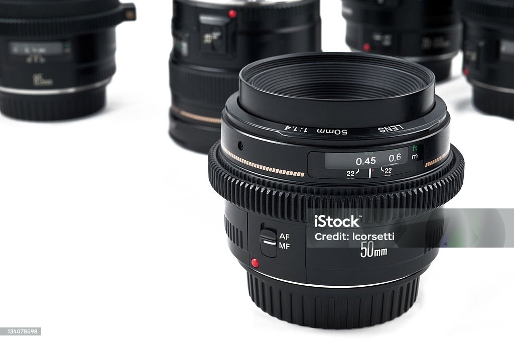 Close-up of 50-millimeter autofocus camera lens some photographic equipment isolated on a white background Aiming Stock Photo