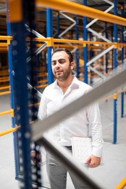 istock Manager doing stocktaking of products in warehouse 1340786437