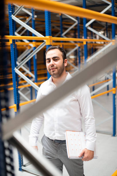istock Manager doing stocktaking of products in warehouse 1340786467