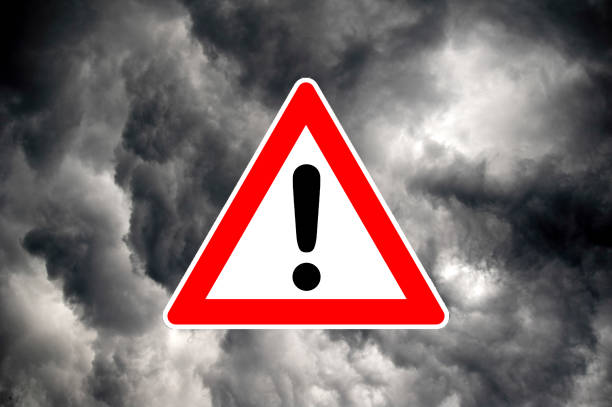 Attention! A warning sign of dramatic rain clouds weather warning sign stock pictures, royalty-free photos & images