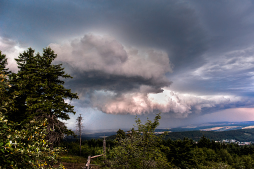 A thunderstorm rises over the Hinteraunus in Hesse