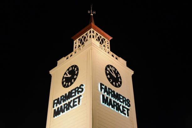 The Original Farmers Market clock tower at night. The Original Farmers Market is an area produce markets in Los Angeles, California (USA)