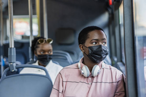 istock Commuting in the bus with a face mask 1340793787