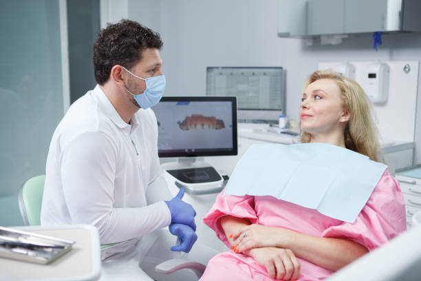 istock Woman getting dental treatment 1340795087