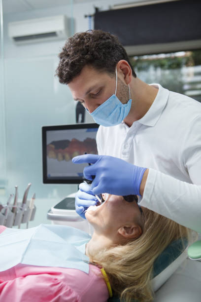 istock Woman getting dental treatment 1340796784