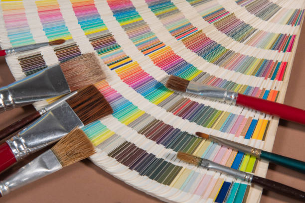 istock Close-up on color palette guide for printing and paintbrush 1340797054