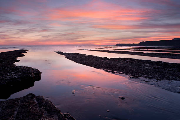 Sunset over Kimmeridge Bay stock photo