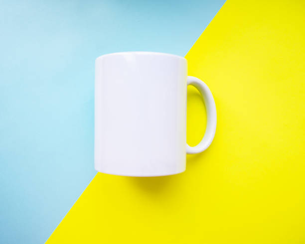 istock White mug clear empty for design on blue yellow background 1340798188