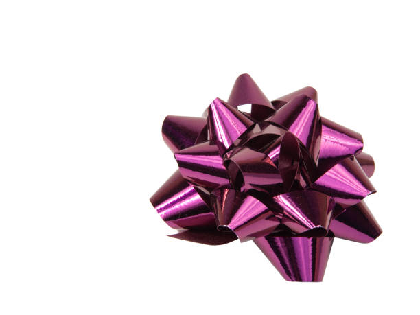 istock Purple foil gift bow isolated on the white background 1340798239