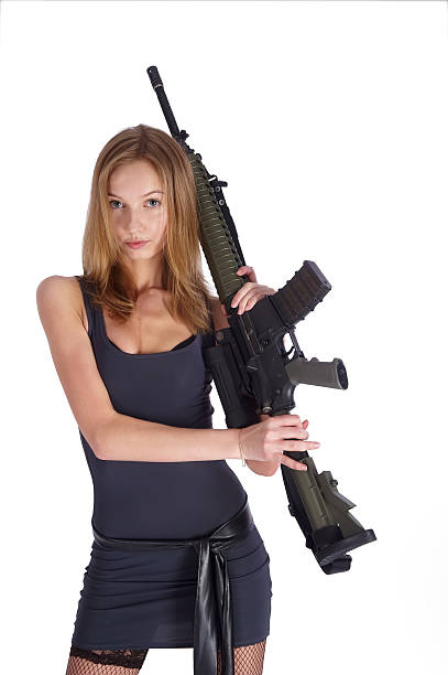 istock Woman with gun on white 134079935
