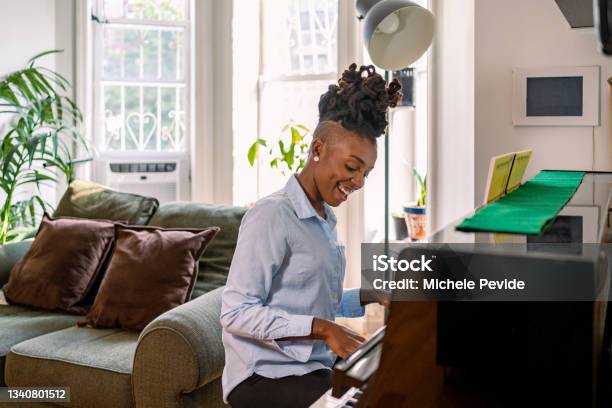 Black Woman Playing Piano At Home Stock Photo - Download Image Now - Adult, Happiness, Piano