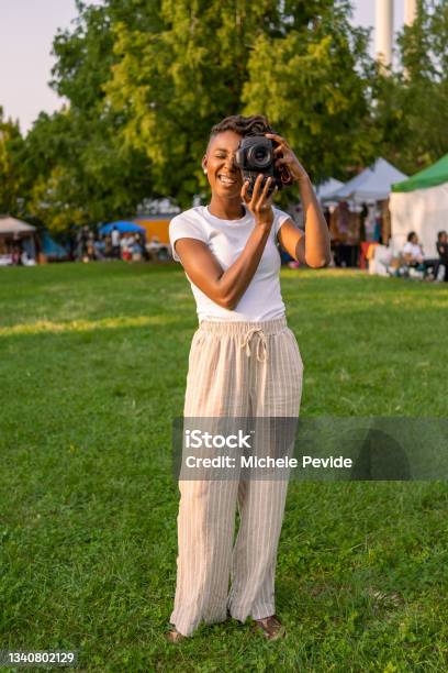 Black Woman Photographing Outdoors Stock Photo - Download Image Now - 30-34 Years, 35-39 Years, Adult