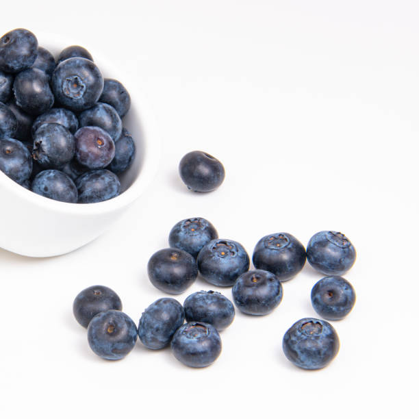 istock Fresh blueberry in white dish on the white background 1340804074