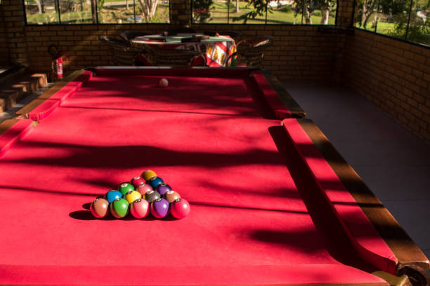 billiard balls on table in game room - snooker table imagens e fotografias de stock