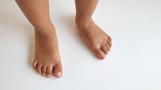 Asian children's feet. isolated with white background