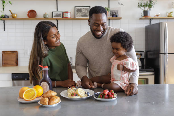 istock Happy family enjoying breakfast together 1340809281