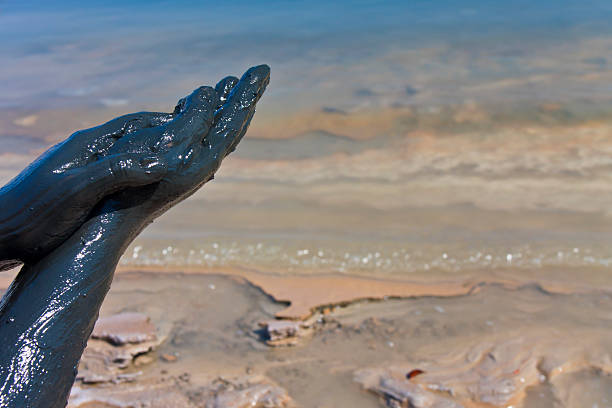 istock Woman hands smeared in dead sea mud 134081039